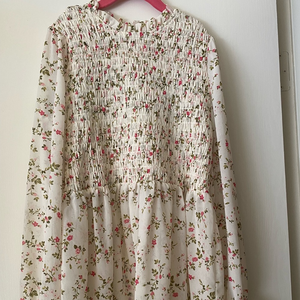 smocked puff sleeve white shirt with flowers. good condition. worn twice